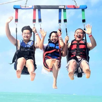 a person standing next to a body of water