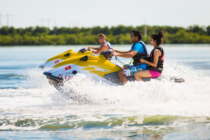 a person riding a surf board on a body of water