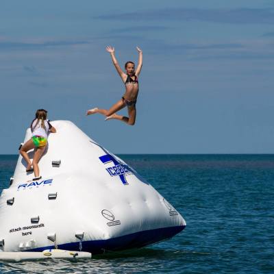 a person riding on the back of a boat in a body of water