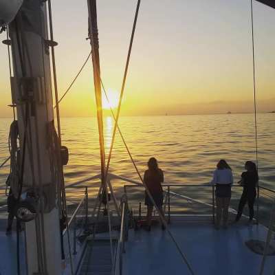 a group of people in a boat on a body of water