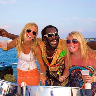 a person standing next to a body of water