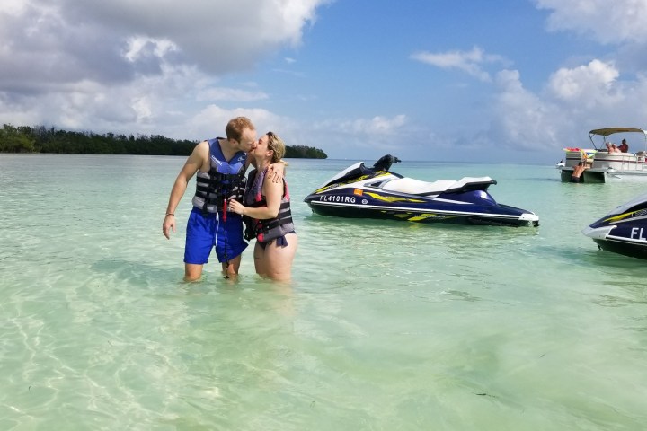 a group of people in a boat on a body of water