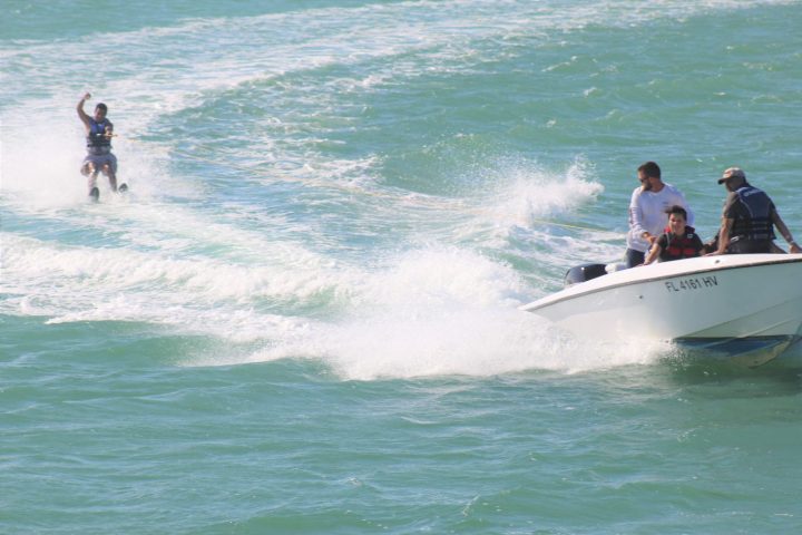 a man riding a wave on a surfboard in the water